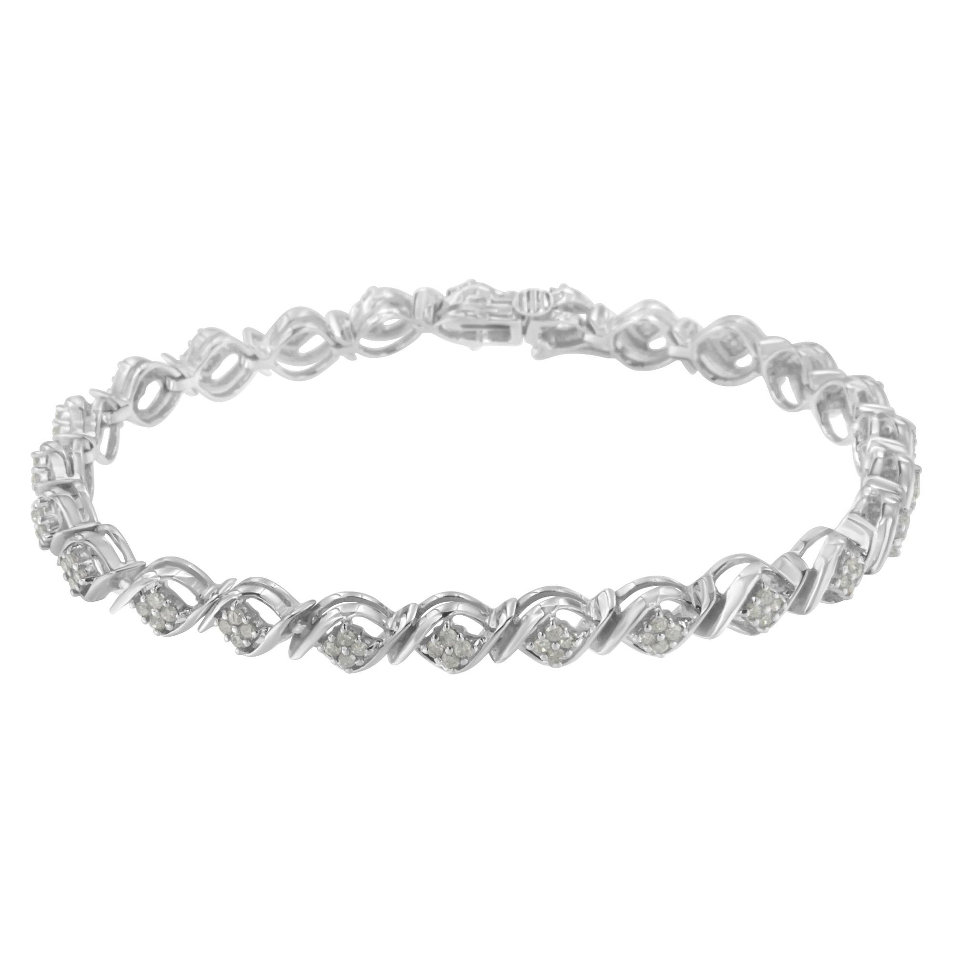 White metal bracelet with alternating looped links and clusters of round white gemstones in prong settings, shown from a frontal angle.
