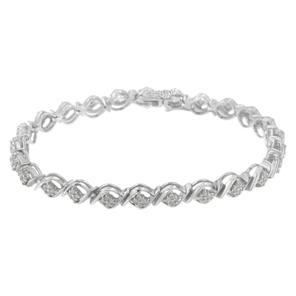 White metal bracelet with alternating looped links and clusters of round white gemstones in prong settings, shown from a frontal angle.