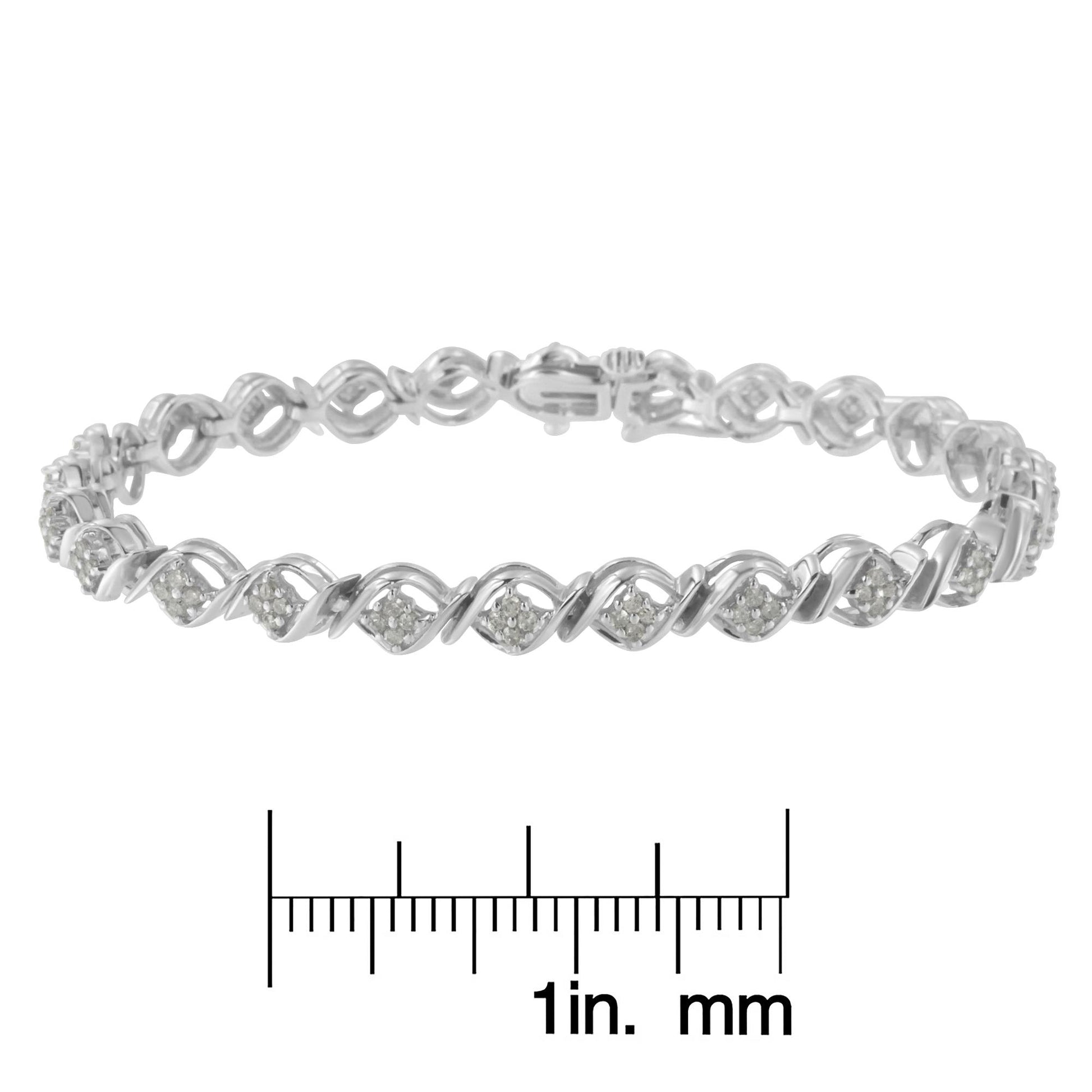 White metal bracelet with alternating twisted links and clusters of round white gemstones in prong settings, displayed above a ruler for size reference, shown from a front-facing angle.