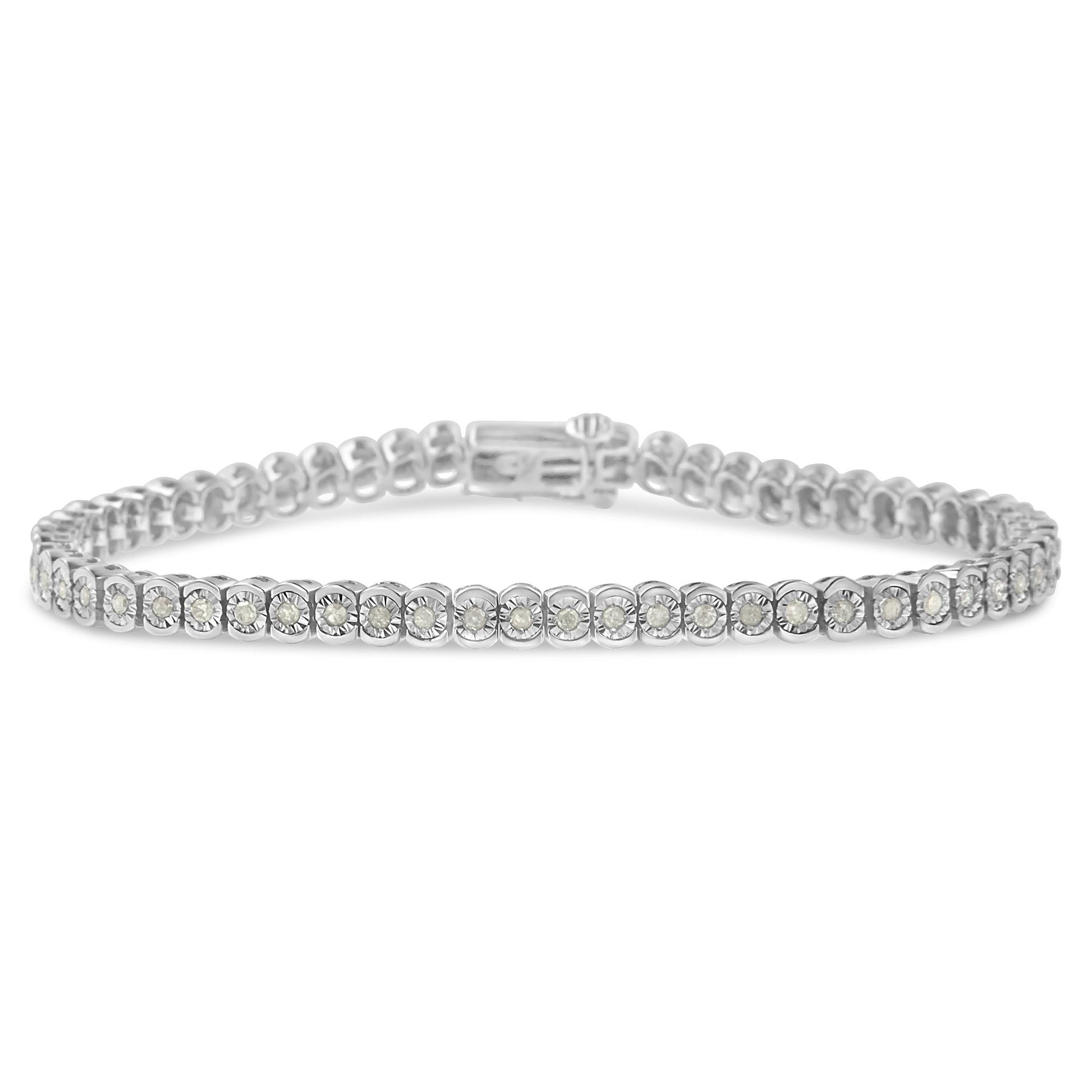 Close-up front-facing shot of a white metal bracelet featuring a continuous row of round white gemstones set in a miracle setting.