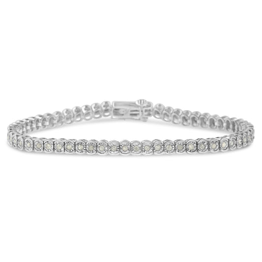 Close-up front-facing shot of a white metal bracelet featuring a continuous row of round white gemstones set in a miracle setting.