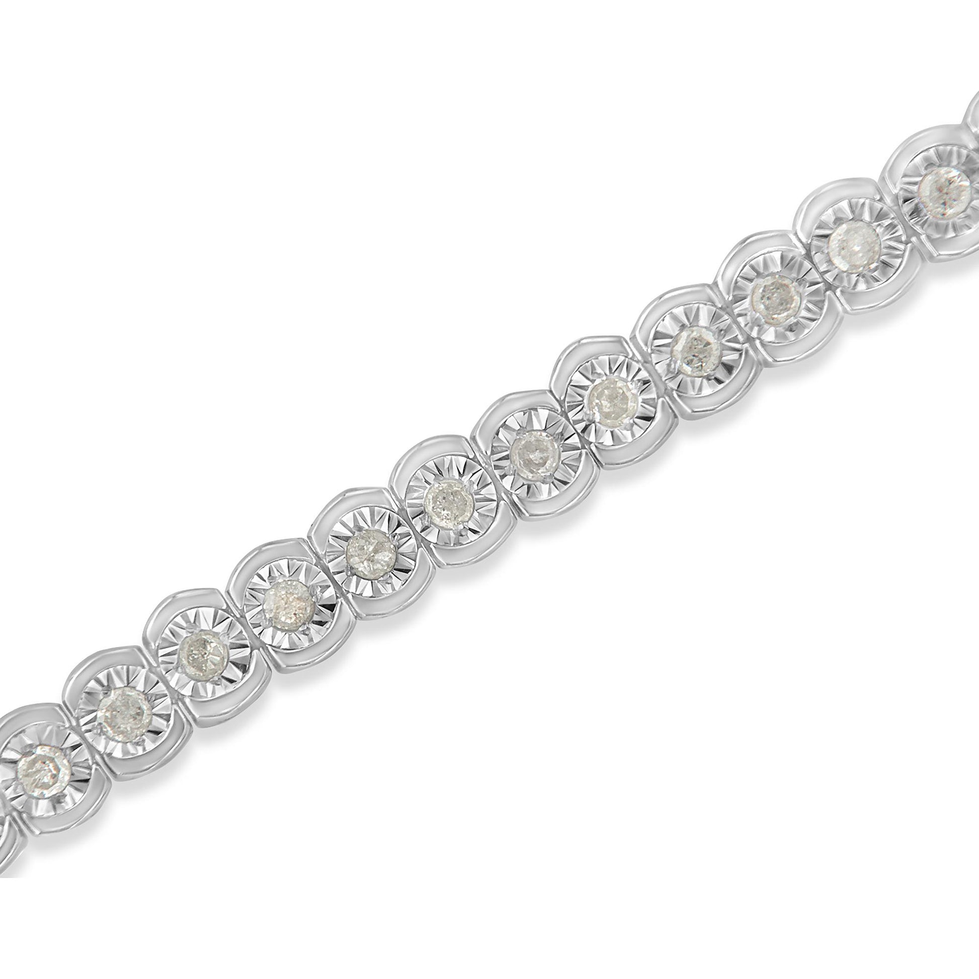 Close-up diagonal view of a white metal bracelet featuring round white gemstones set in a miracle setting.