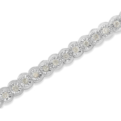Close-up diagonal view of a white metal bracelet featuring round white gemstones set in a miracle setting.