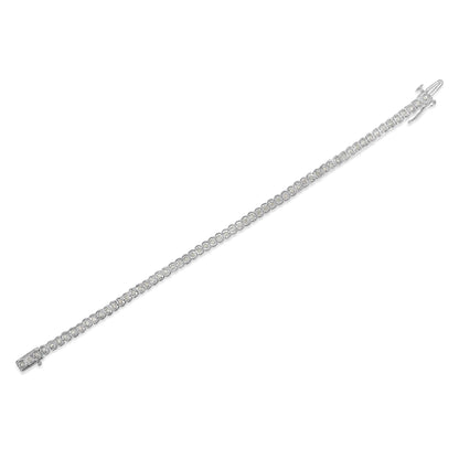 Diagonal top-down view of a white bracelet with round white gemstones set along its length.