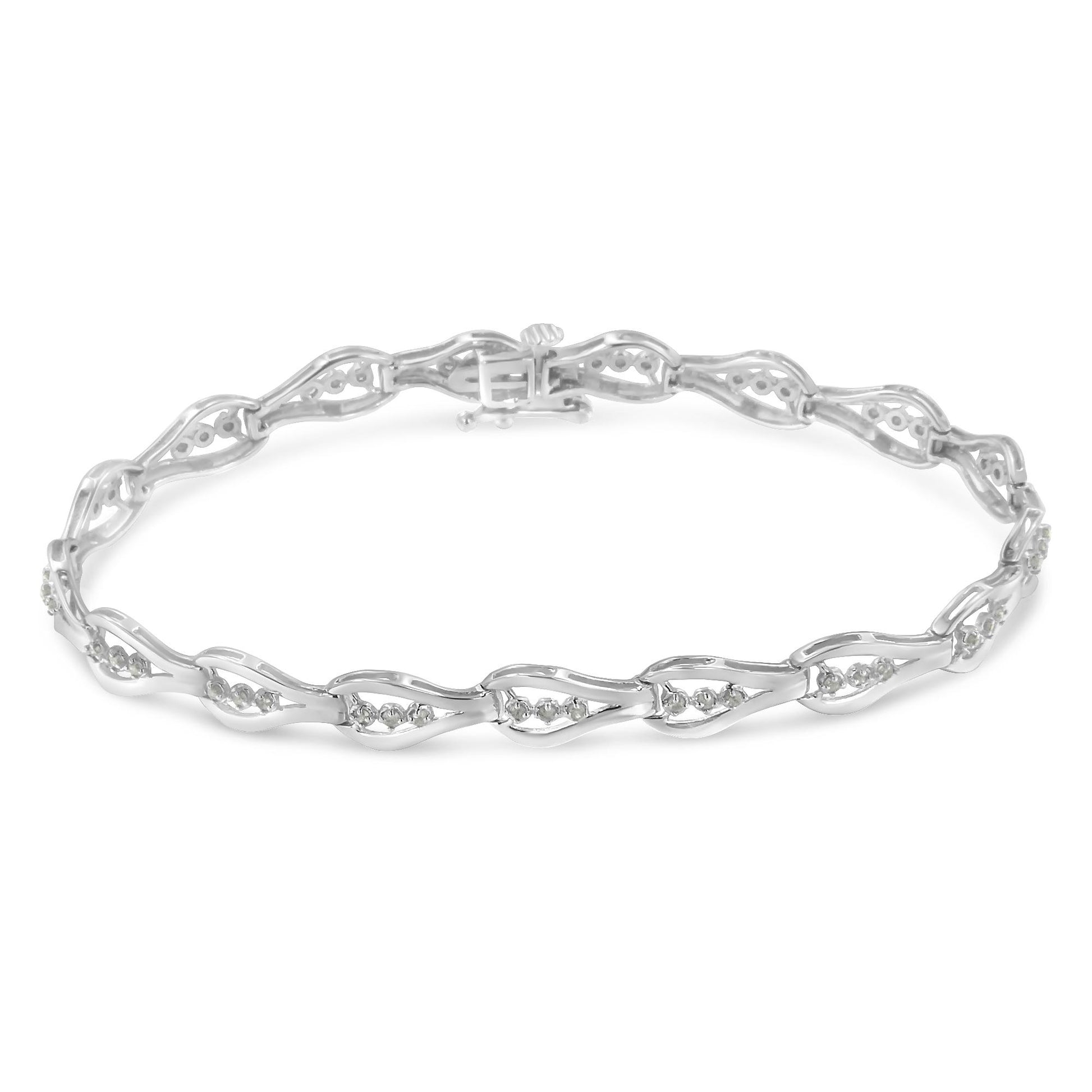 White metal bracelet with alternating open links featuring round white gemstones in prong settings, shown from a top angled view.