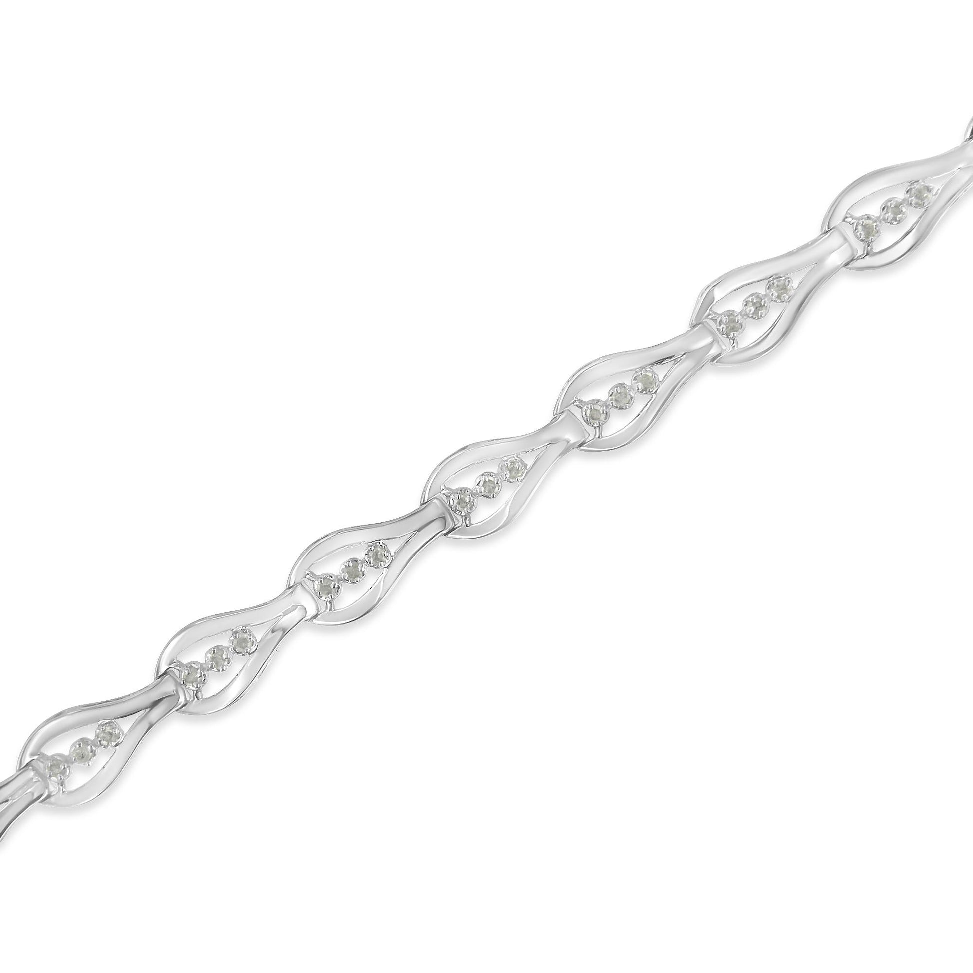 White metal bracelet with repeating linked teardrop shapes, each set with round white gemstones in prong settings, shown in a diagonal close-up view.