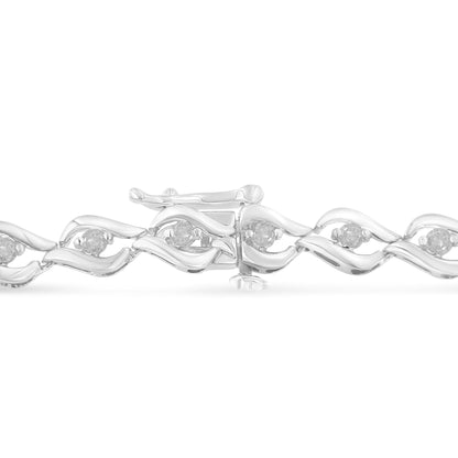 Close-up front angle of a white metal bracelet with a wavy design, featuring round white gemstones in prong settings along the length.