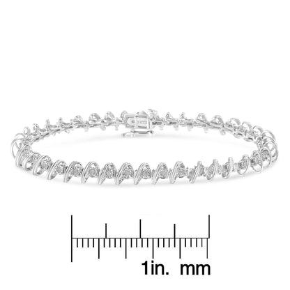 White metal bracelet with round white gemstones in miracle setting, displayed flat on a ruler for size reference, shot at a slight angle.