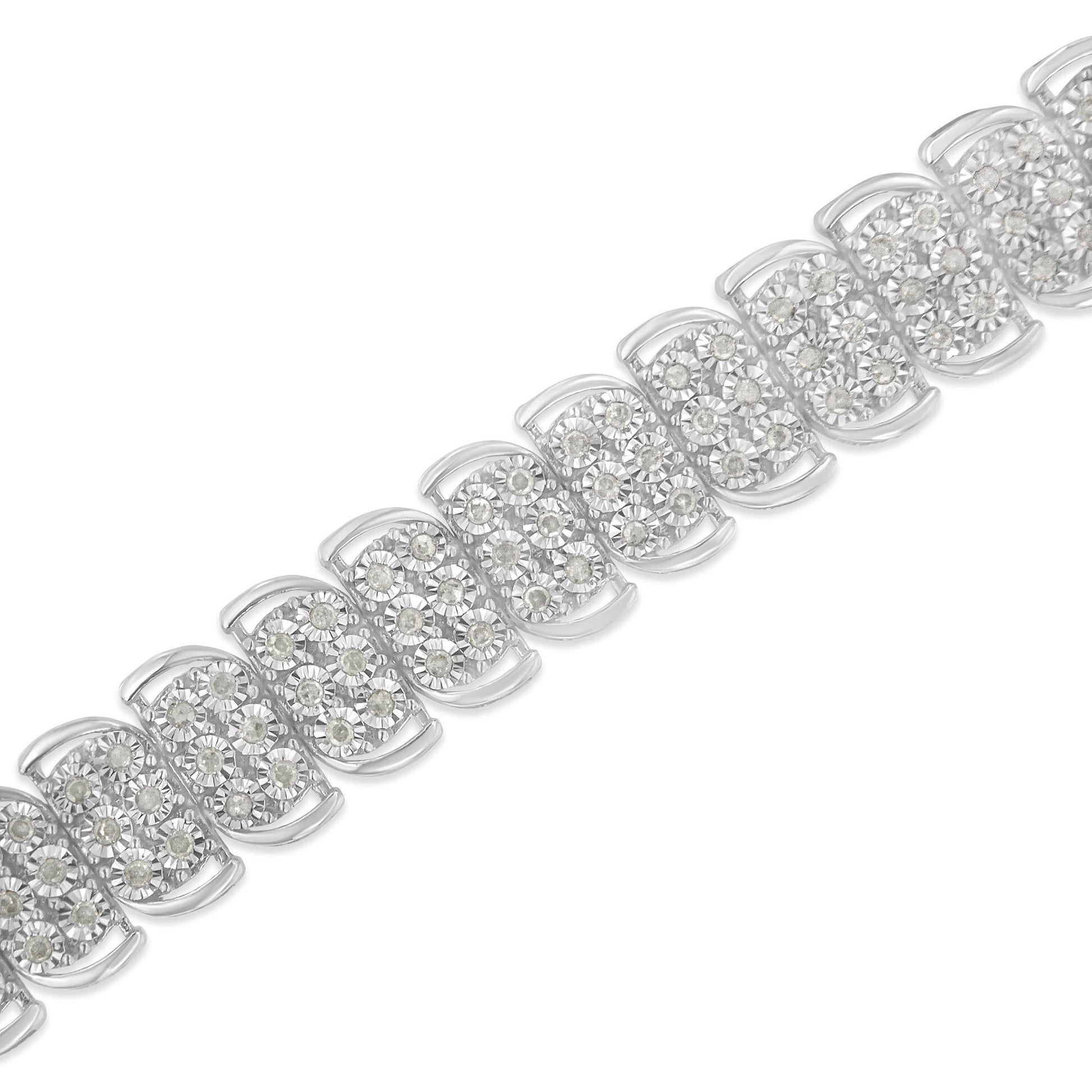 Close-up diagonal view of a white metal bracelet featuring multiple linked segments each set with round white gemstones in a clustered arrangement.