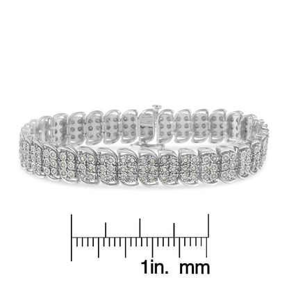 White metal bracelet with rows of round white gemstones in miracle setting, displayed flat above a ruler for size reference, shot from a front angle.