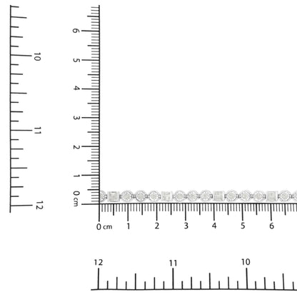 White bracelet with alternating round and baguette white gemstones, shown in a close-up top-down view on a ruler for size reference.
