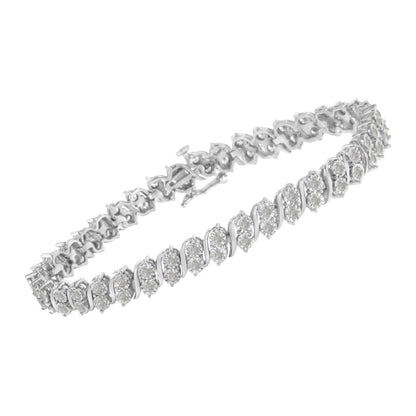 White metal bracelet with round white gemstones set in a spiral pattern, shown at an angled top view.