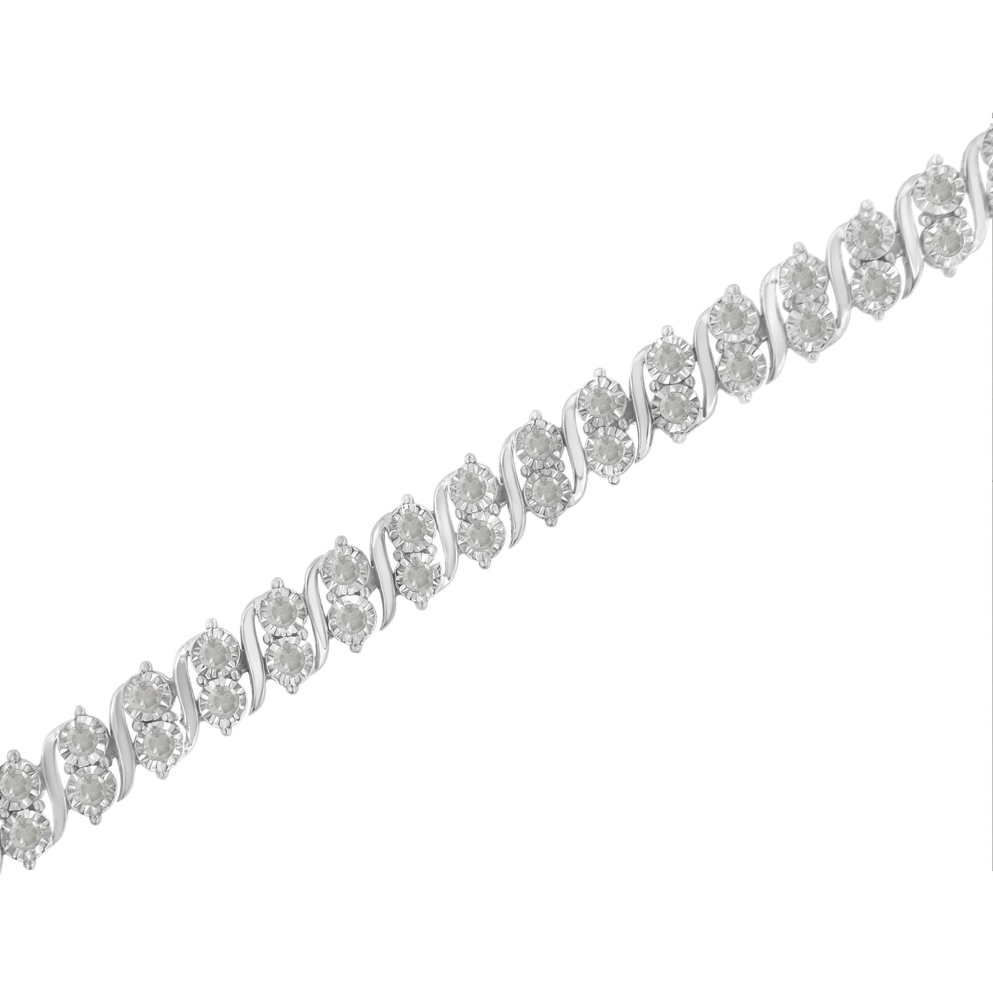 Close-up diagonal view of a white metal bracelet featuring multiple round white gemstones in a miracle setting.