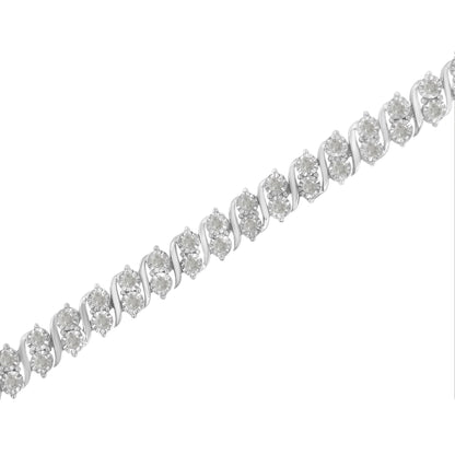 Close-up diagonal view of a white metal bracelet featuring multiple round white gemstones in a miracle setting.