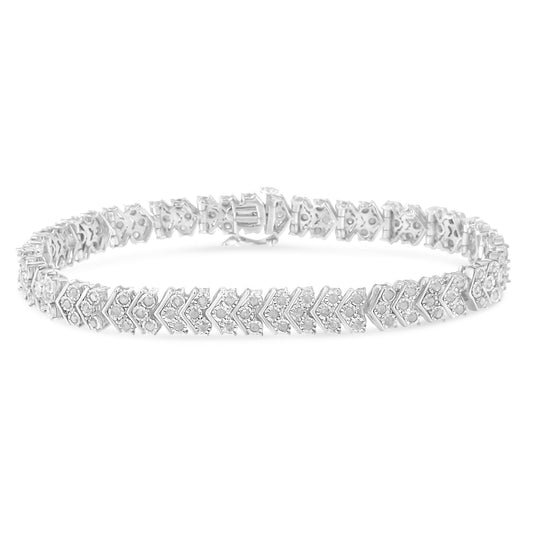White metal bracelet with round white gemstones in a miracle setting, shown from a slightly angled top view.