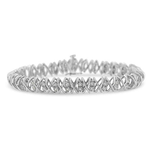 White metal bracelet with crisscross design and round white gemstones set in clusters, front-facing angle.