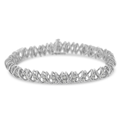 White metal bracelet with round white gemstones set in a crisscross design, shown from a slight front angle.