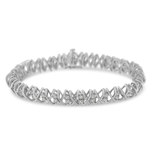 White metal bracelet with round white gemstones set in a crisscross design, shown from a slight front angle.