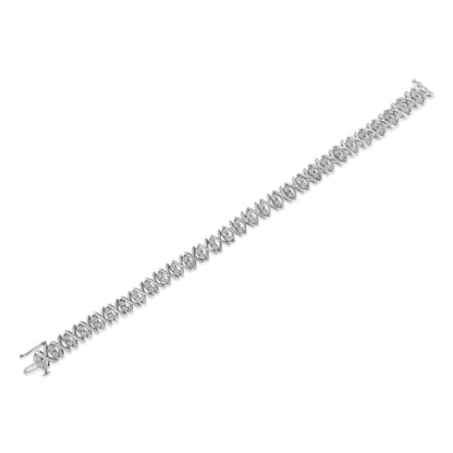 White metal bracelet with round white gemstones in a crisscross pattern, shown from a top angled view.