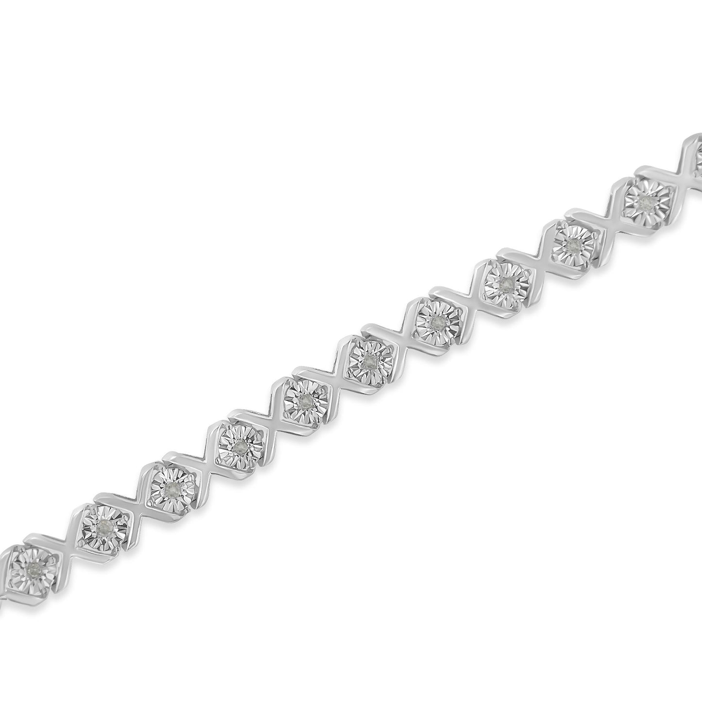 Diagonal close-up of a white metal bracelet with round white gemstones in a miracle setting.
