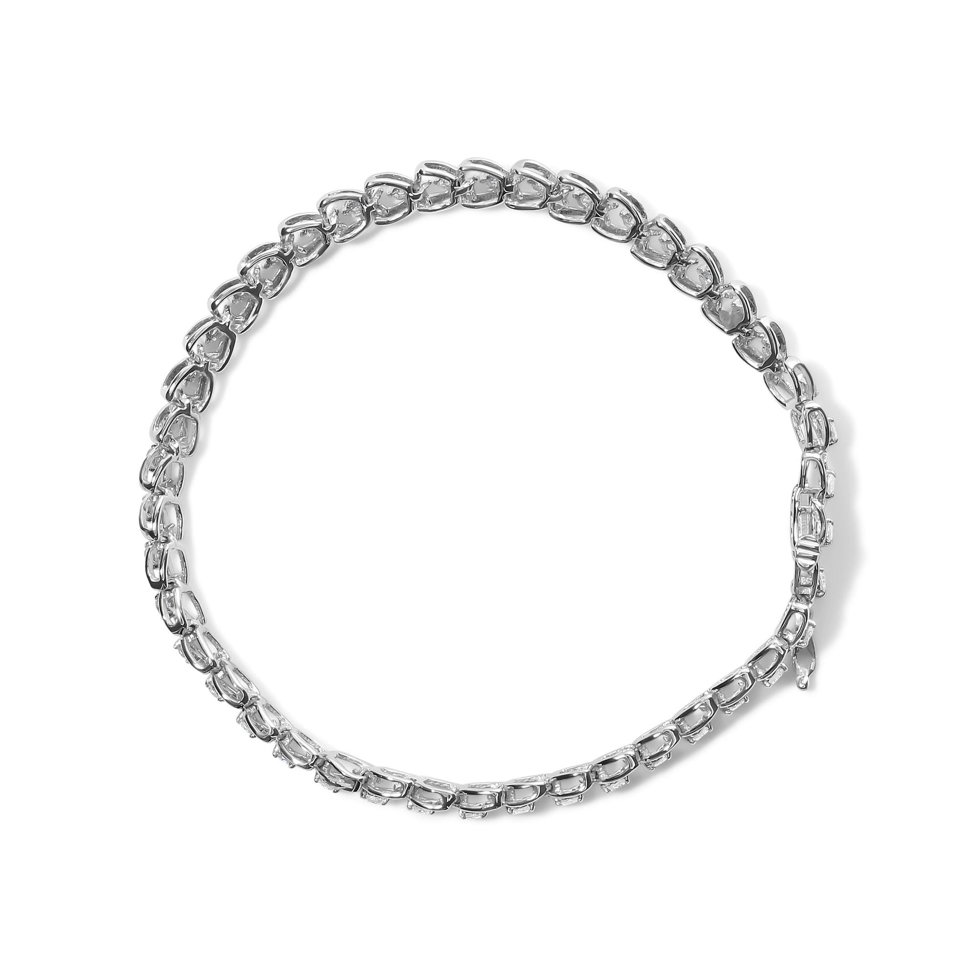 Top-down view of a white metal bracelet featuring round prong-set white gemstones in a continuous linked design.