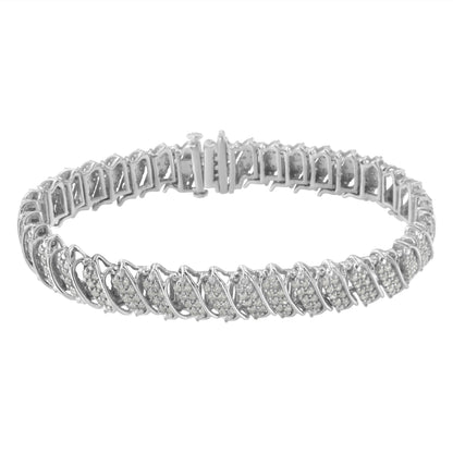 White metal bracelet with round white gemstones in pave setting, photographed from an angled top view.