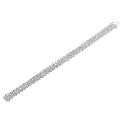 White bracelet with round white gemstones in pave setting, shown from a top angle.