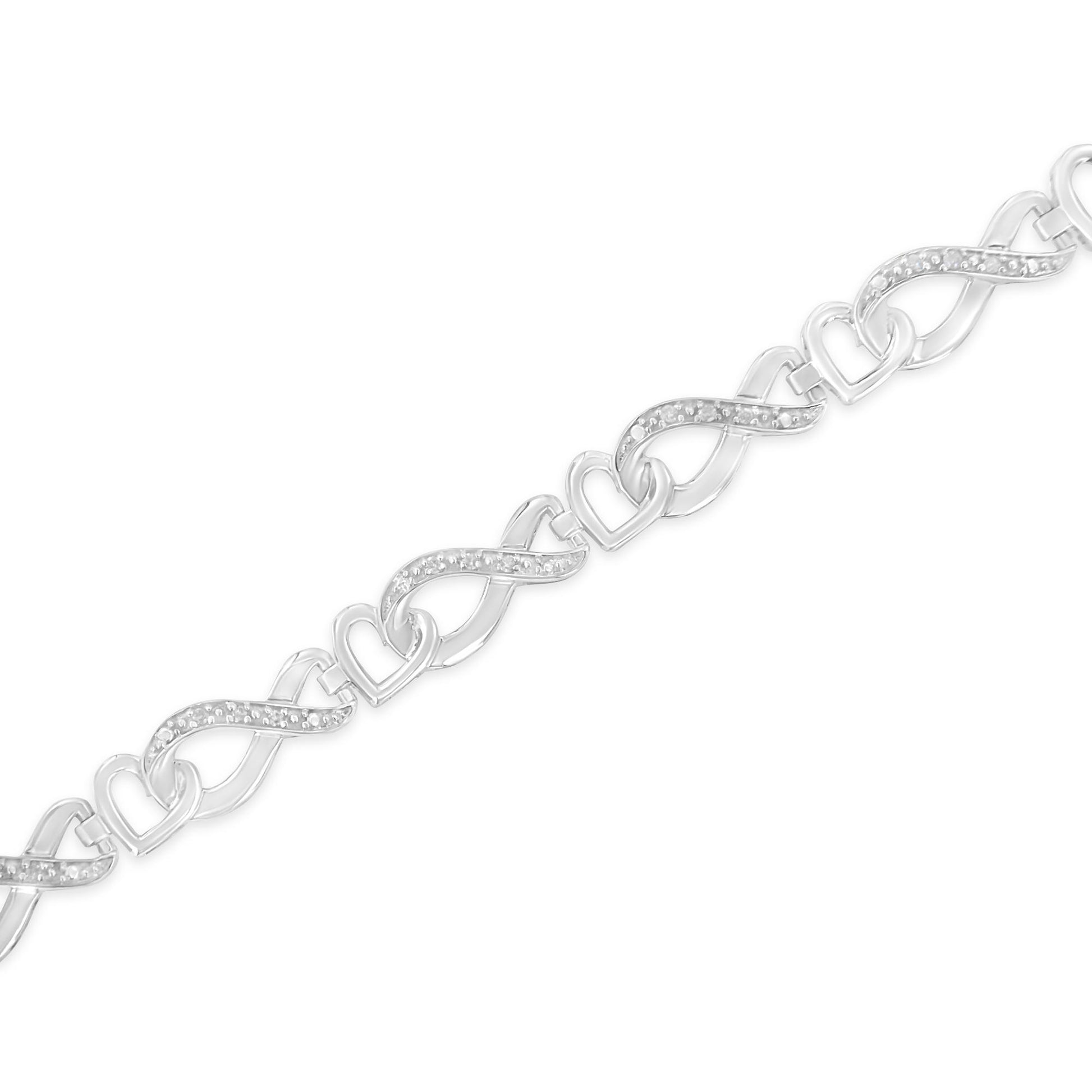 White metal bracelet with alternating heart and infinity-shaped links; infinity links feature white gemstones in pave setting, shown in a diagonal close-up view.
