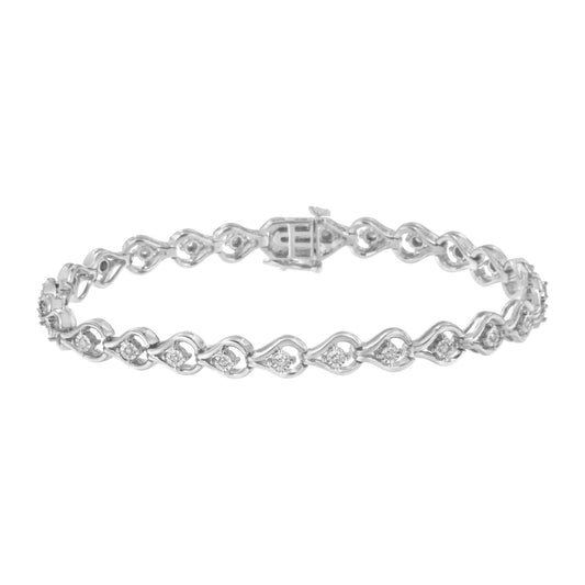 White metal bracelet with round white gemstones in miracle setting, shown from a side angle.