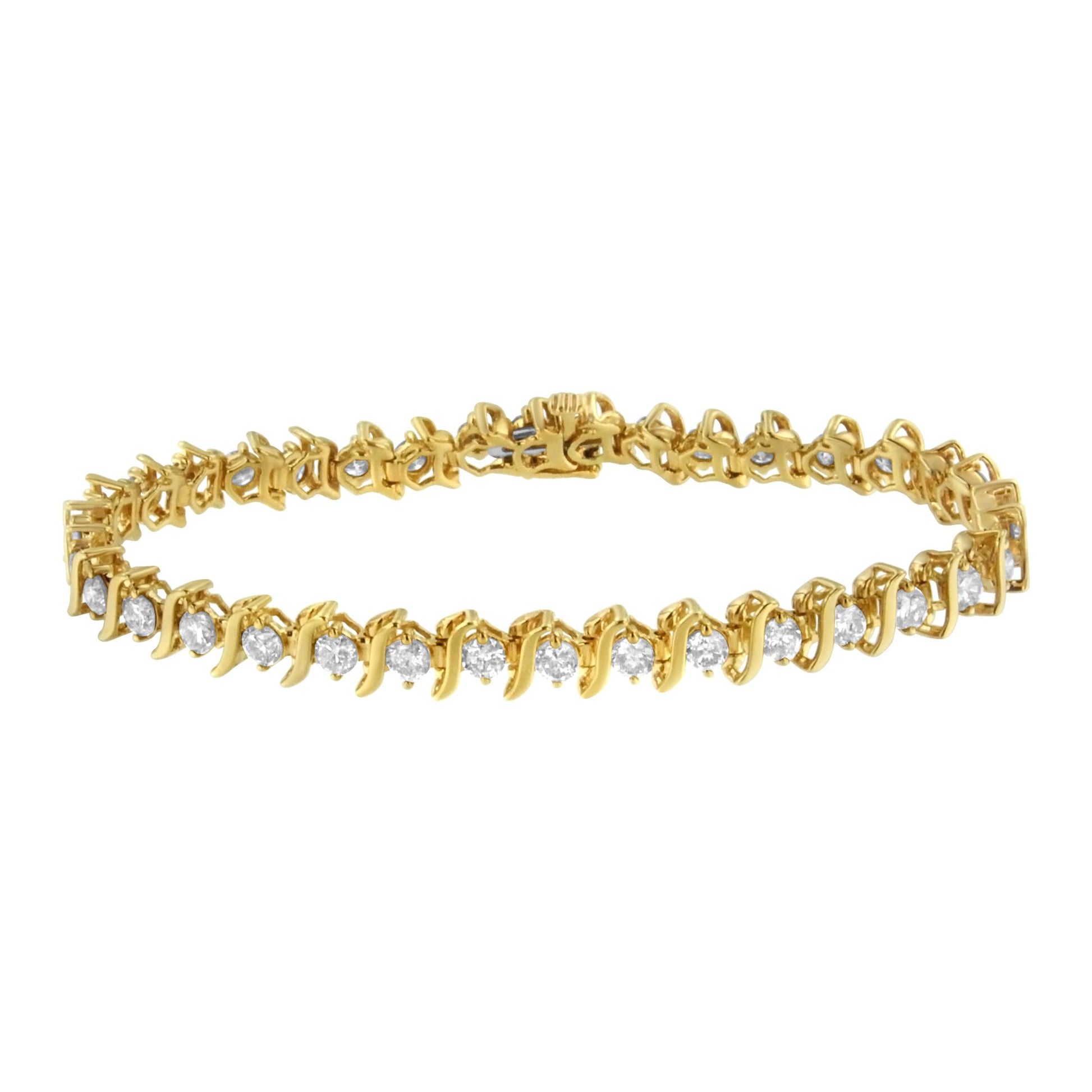 Yellow metal bracelet with round prong-set white gemstones, shown from an angled top view.