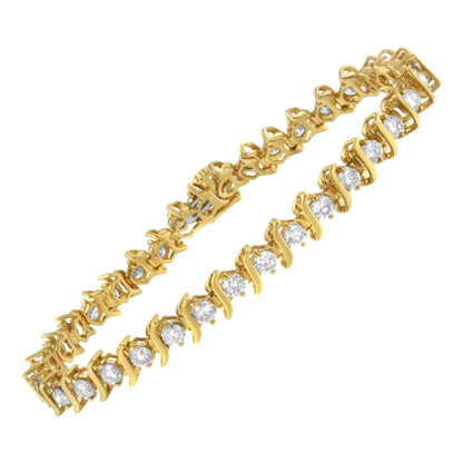 Yellow bracelet with round prong-set brownish gemstones viewed from an angled top perspective.