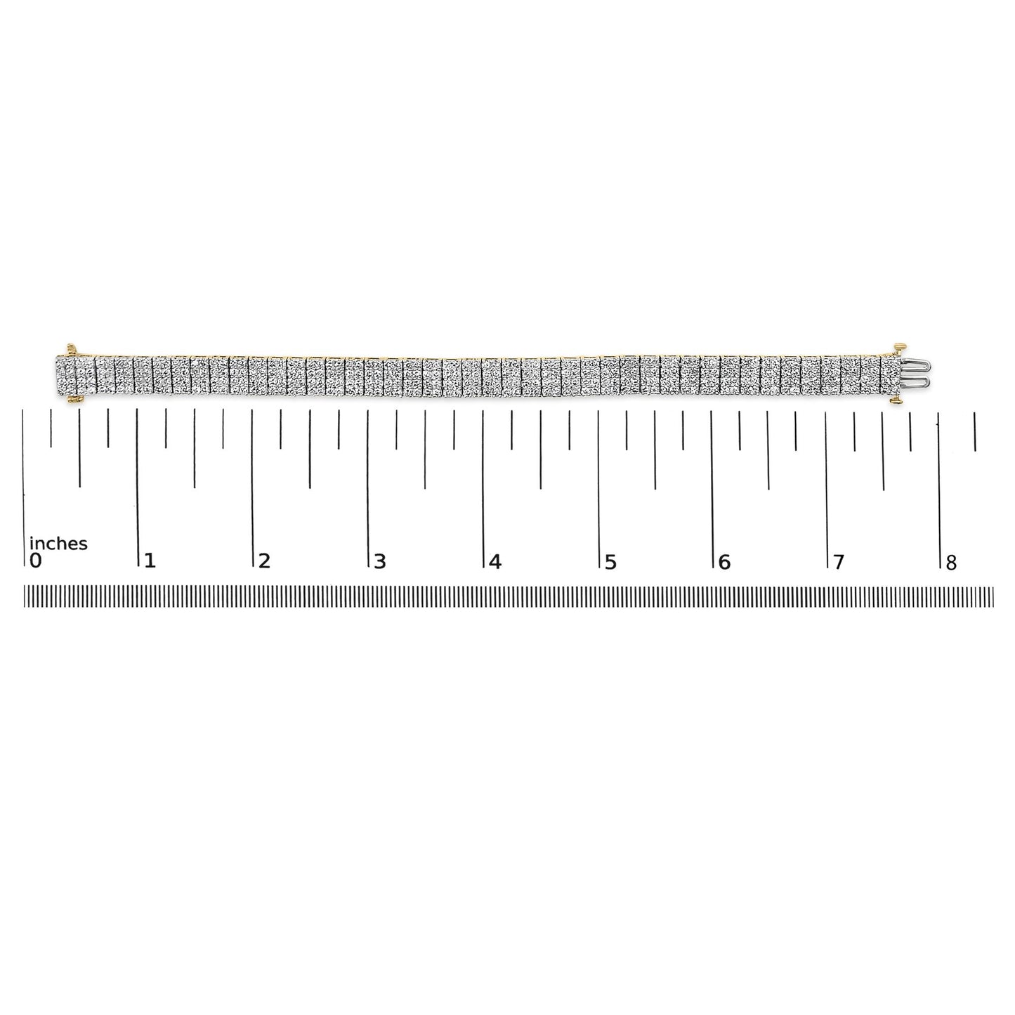 Yellow metal bracelet with rows of white round gemstones in shared prong setting, displayed flat on a ruler scale, shot from above.