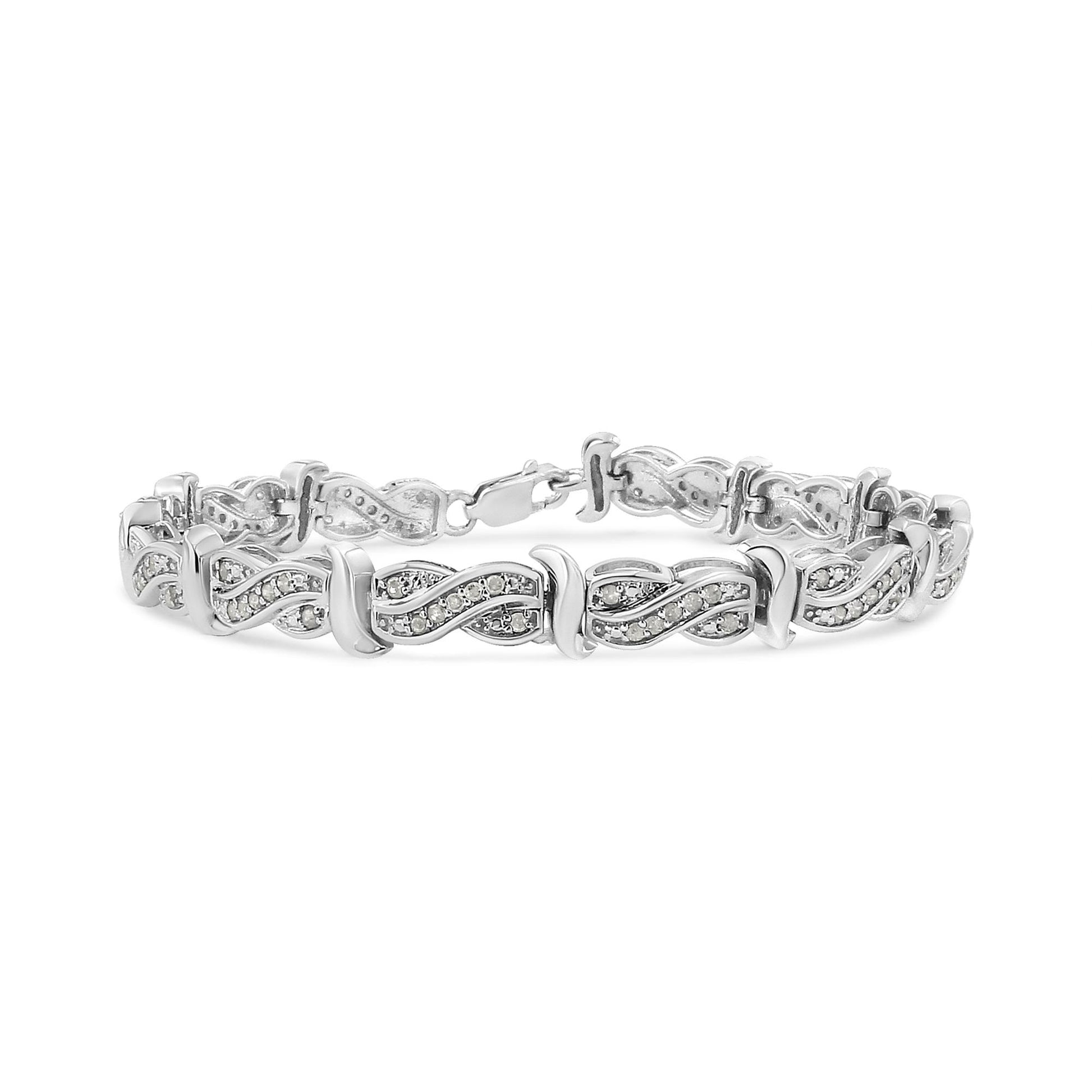 White metal bracelet with linked infinity-shaped segments featuring pave-set round white gemstones, shown from a front angle.