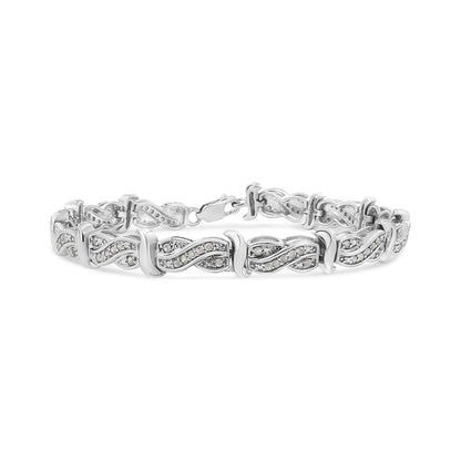 White metal bracelet with linked infinity-shaped segments featuring pave-set round white gemstones, shown from a front angle.