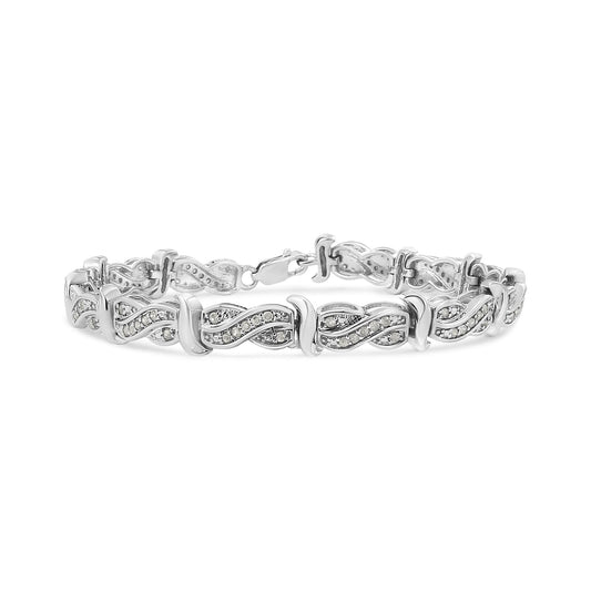 White metal bracelet with linked infinity-shaped segments featuring pave-set round white gemstones, shown from a front angle.
