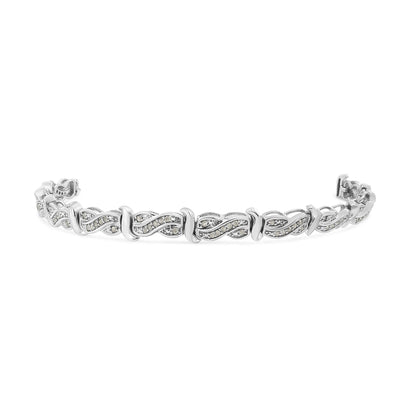 White metal bracelet with alternating twisted design segments set with round white gemstones in pave setting, shown from an angled front view.