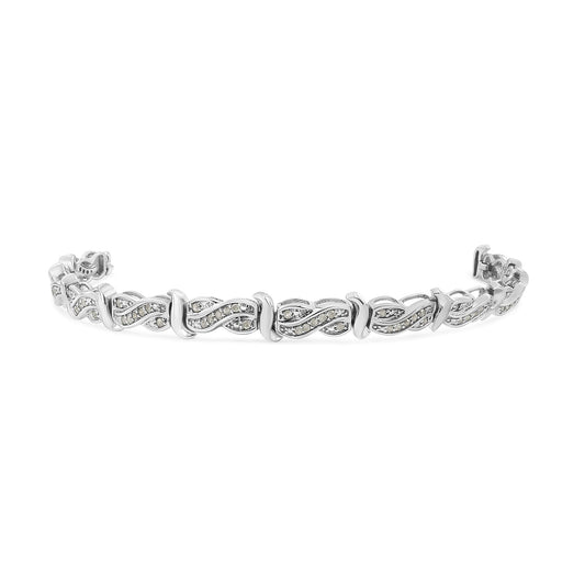 White metal bracelet with alternating twisted design segments set with round white gemstones in pave setting, shown from an angled front view.
