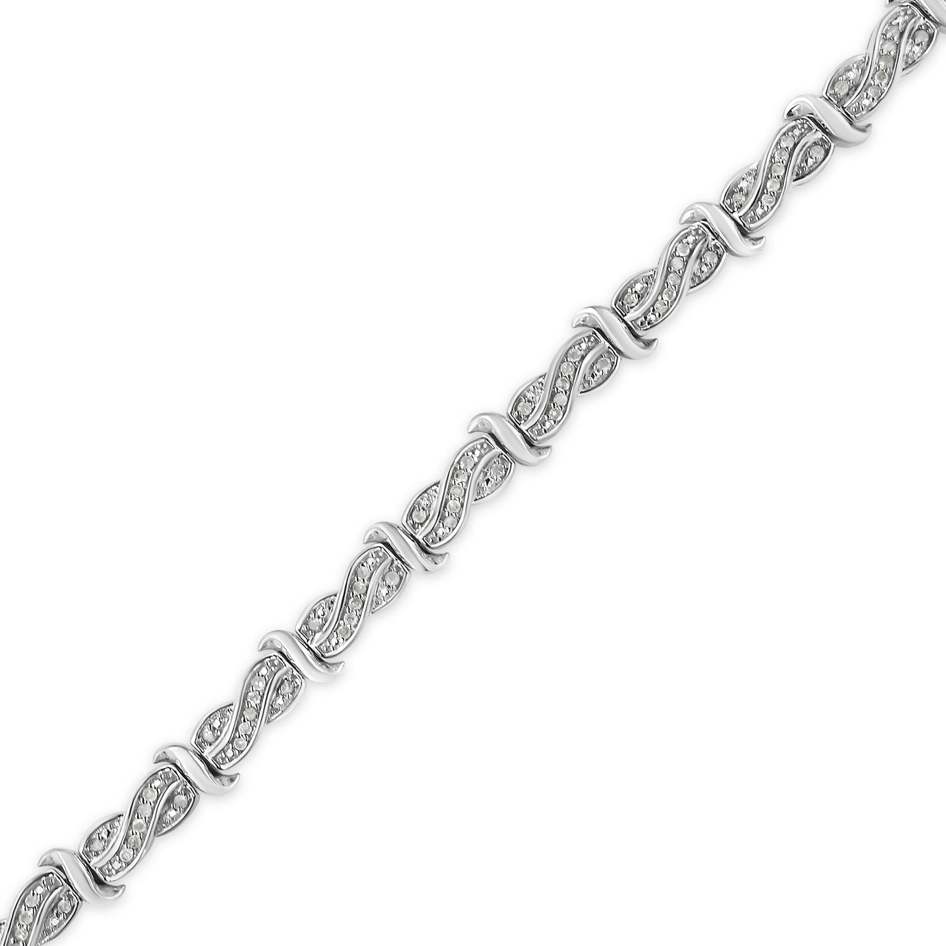 White metal bracelet with alternating twisted links featuring round white gemstones in pave setting, shown in a flat lay angled view.