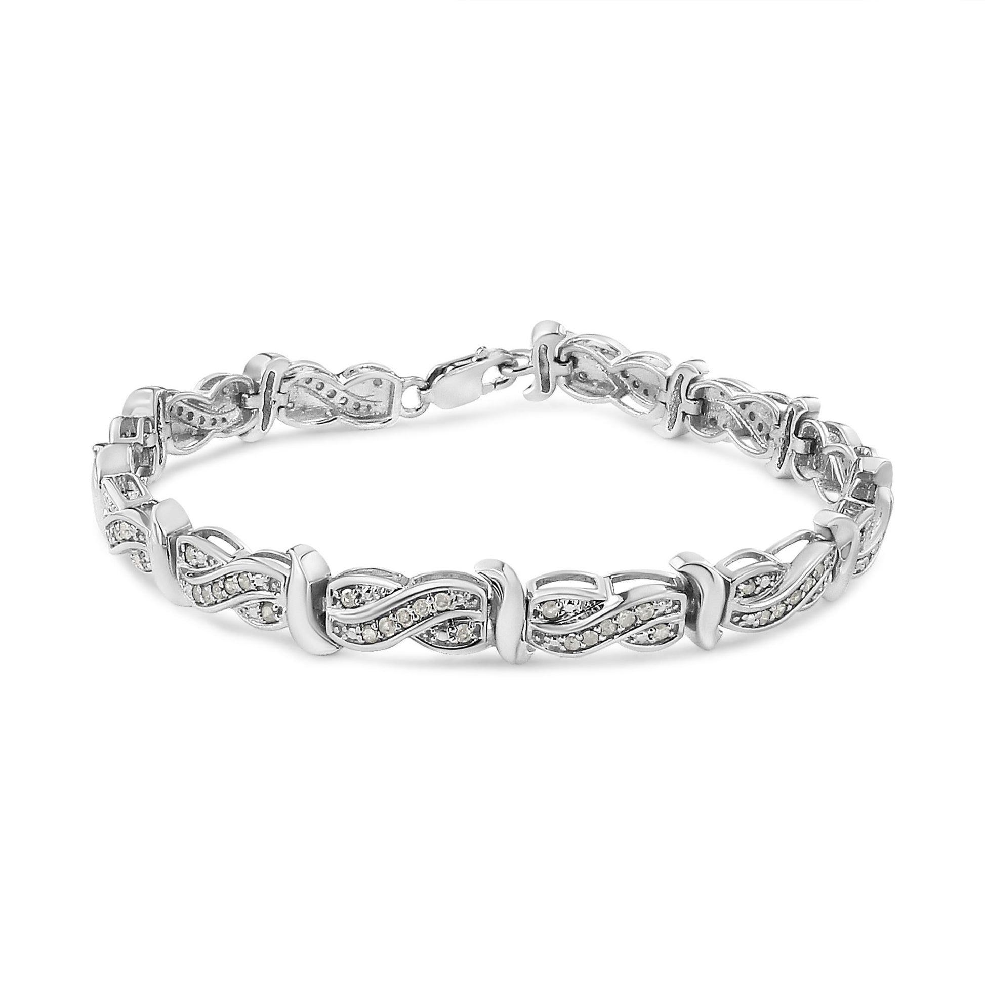 White metal bracelet with intertwined links featuring pave-set round white gemstones, shown from a front angle on a white background.
