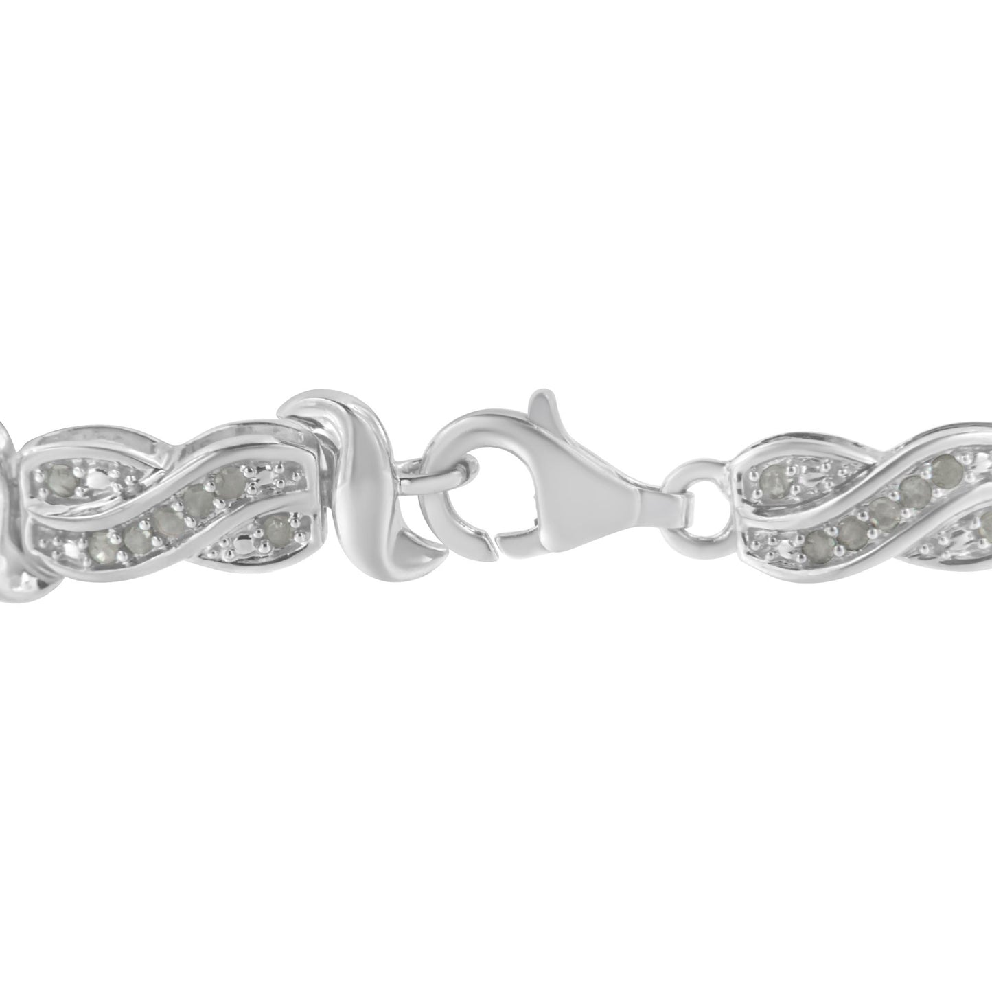 Close-up front angle of a white metal bracelet with a lobster clasp and linked segments featuring a waved design set with round white gemstones in pave setting.