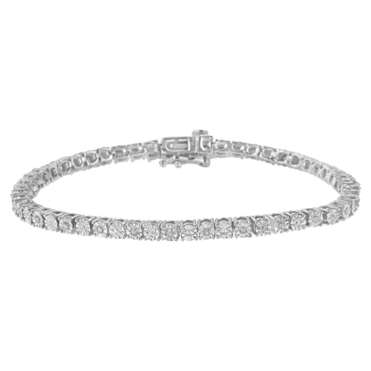 White metal bracelet with round white gemstones in prong settings, shown from a front close-up angle.