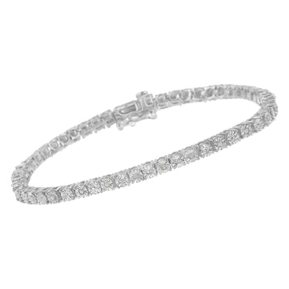 White metal bracelet with round prong-set white gemstones, shown from a side angle.