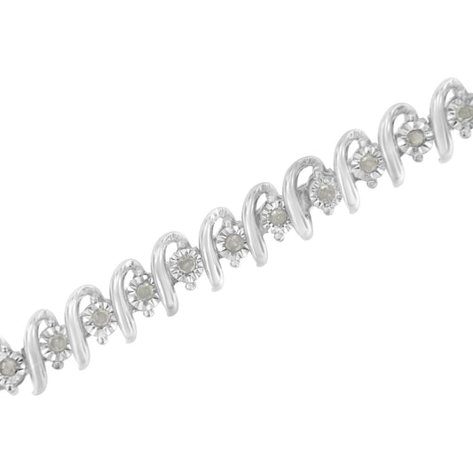 White metal bracelet with alternating round white gemstones and curved metal designs, shown in a close-up angled view.