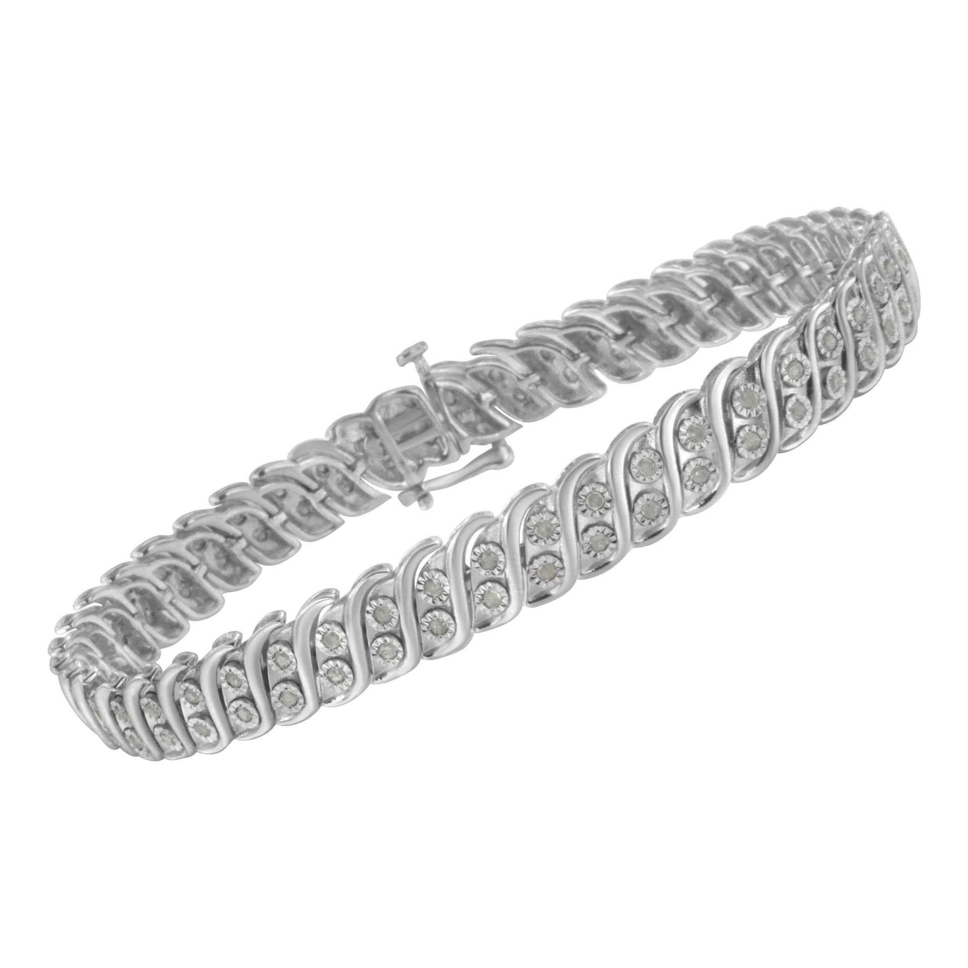 White metal bracelet with round white gemstones in a swirl design, shown from a slightly angled top view.