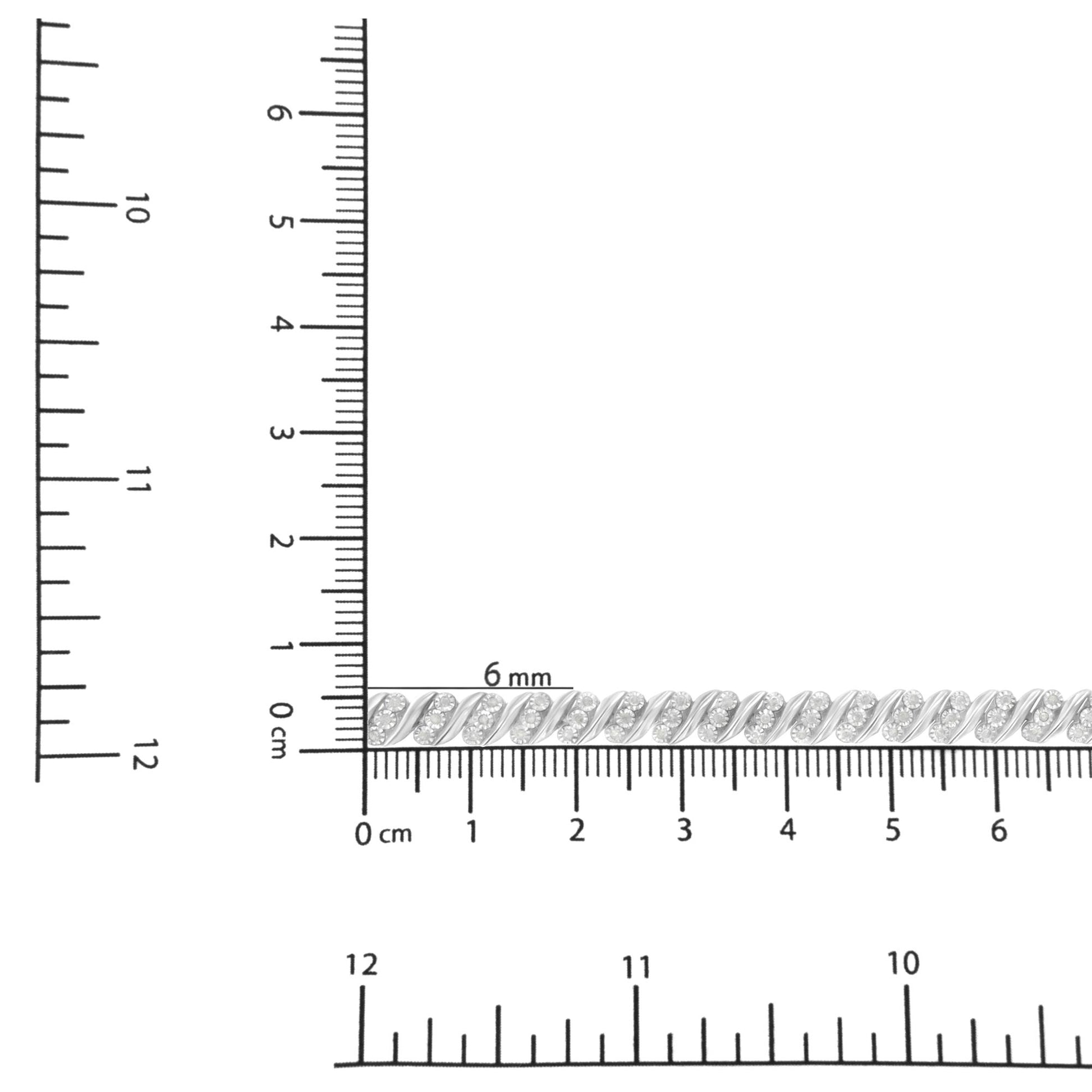 Close-up front angle of a white metal bracelet with round white gemstones in a twisted design, placed on a ruler for size reference.