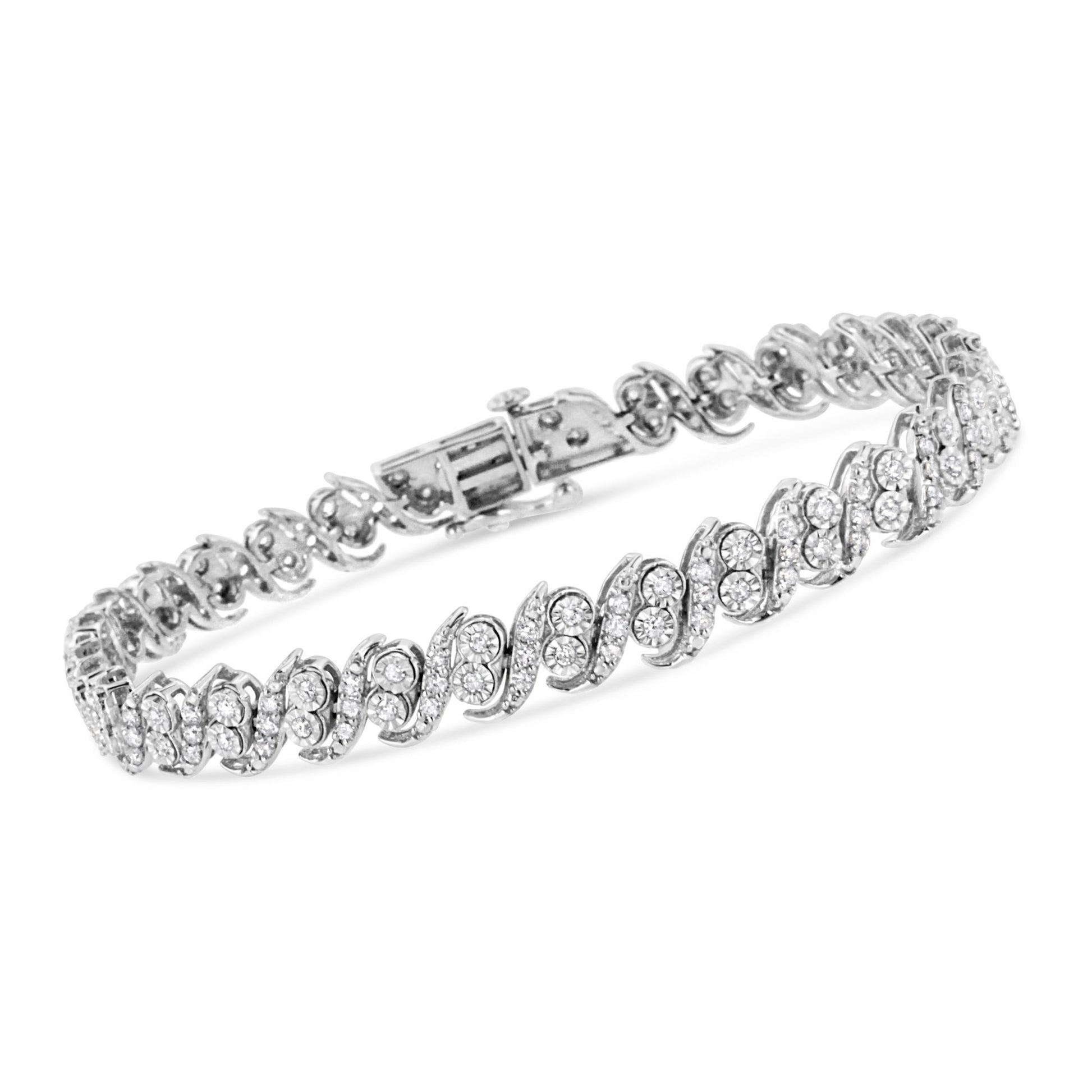 White metal bracelet with wavy design, set with round white gemstones in prong settings, shown from a side angle.