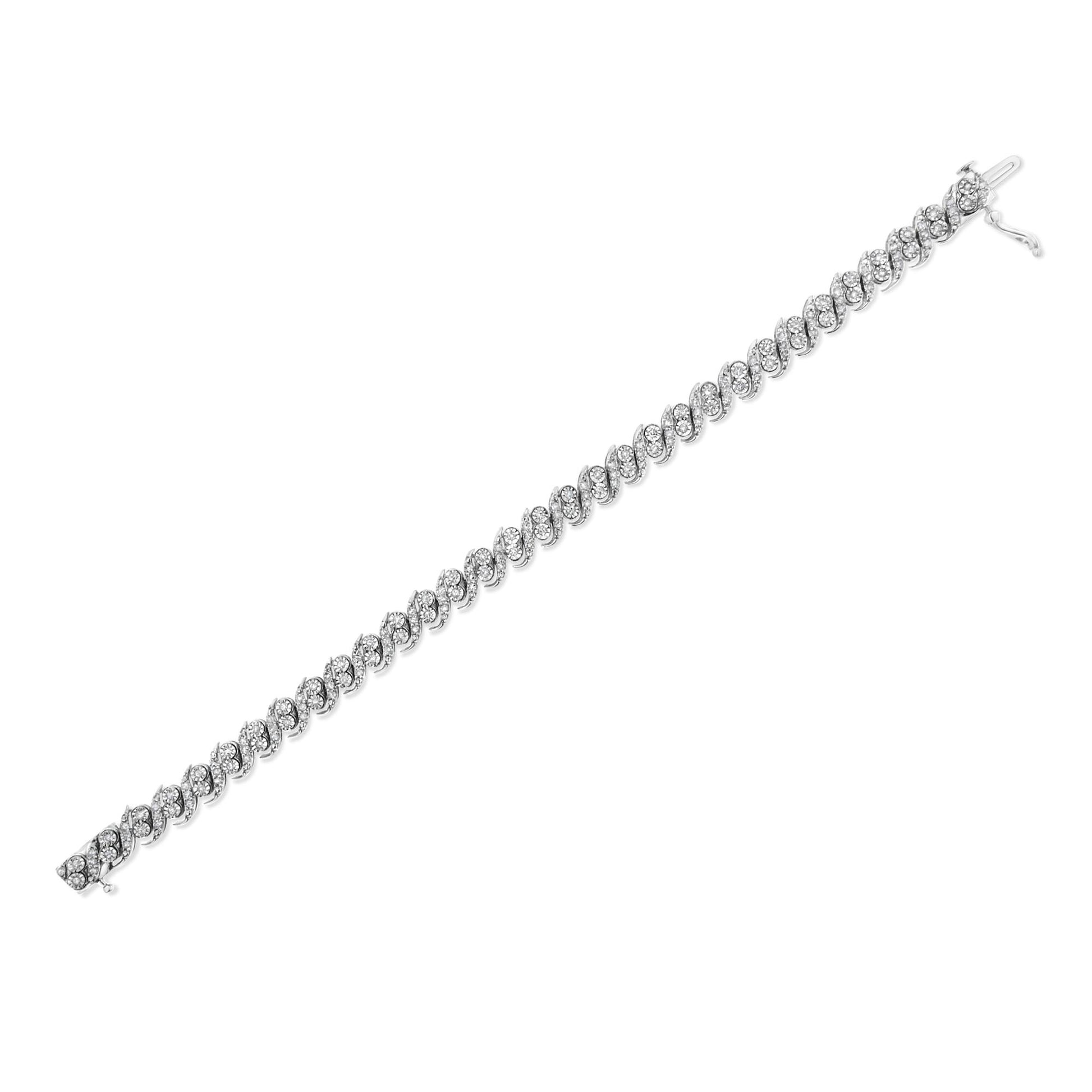 White metal bracelet with interlocking oval links, each set with multiple round white gemstones in prong settings, shown at a diagonal angle on a white background.