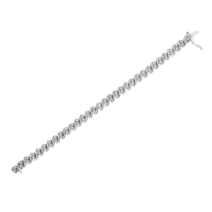 White metal bracelet with interlocking oval links, each set with multiple round white gemstones in prong settings, shown at a diagonal angle on a white background.