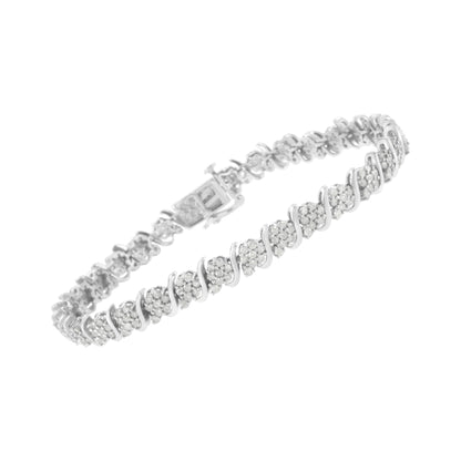 White metal bracelet with round white gemstones in prong settings, shown at a slight angled top view.