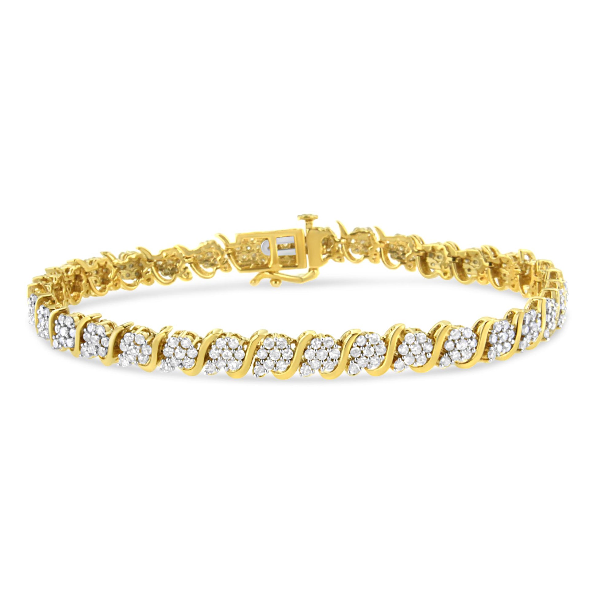 Yellow metal bracelet with alternating clusters of white round gemstones in prong settings, shown from a slight angled front view.